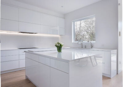 Modern white kitchen island with waterfall ends, custom cabinetry Toronto