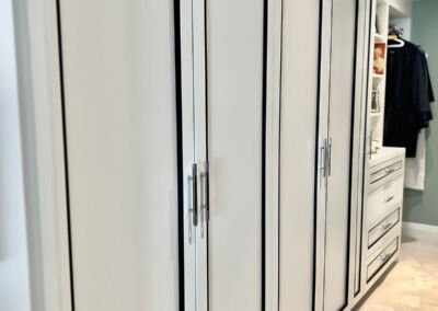 White tall cabinet with black inlay detail, Toronto