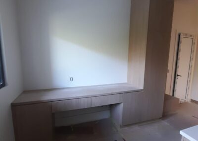 Built-in oak desk with tall storage cabinet