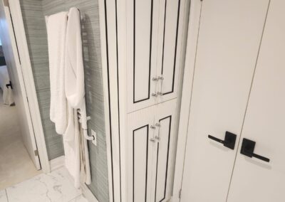 Matching white linen tower with black inlay and fluted centre panel