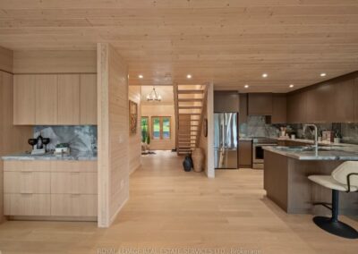 Cottage kitchen with wood-grain cabinetry and stone counters, Muskoka