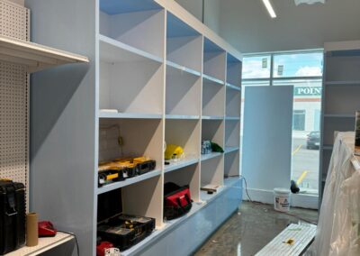 Light blue retail wall shelving, commercial millwork