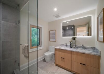 Light oak vanity with a backlit mirror, Muskoka cottage