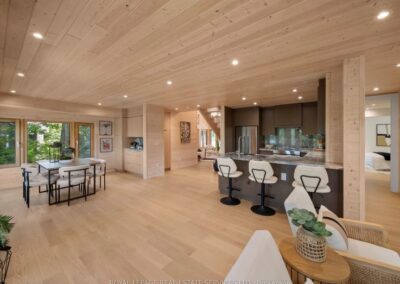 Muskoka cottage kitchen with a seating island and tall pantry wall