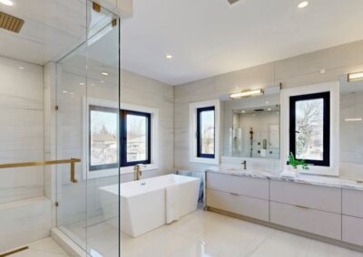 Wall-hung slab-door double vanity in an ensuite, Toronto