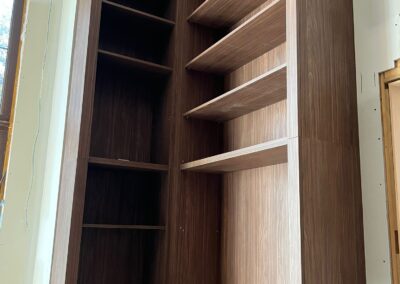 Walnut corner bookcase with adjustable shelves