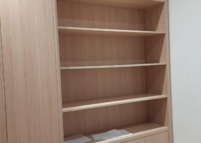 White walk-in closet with full-height doors